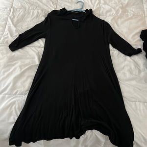 Mid length, lightweight, large rue 21 dress with high neck and cutout.